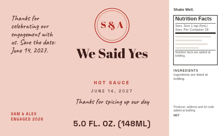Engagement party favor label “We Said Yes” with the couple’s names and a save-the-date line, on a 5 oz mango pineapple hot sauce bottle
