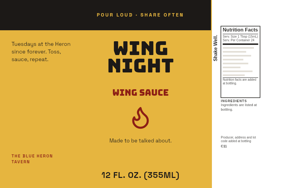 Label “Wing Night” in big type on a 12 oz Cajun wing sauce bottle